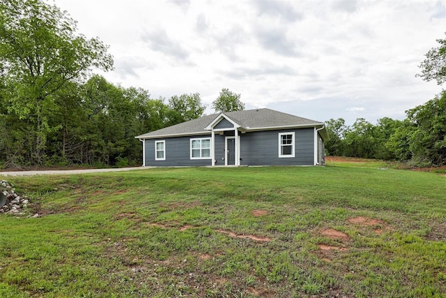 ranch-style home with a front yard