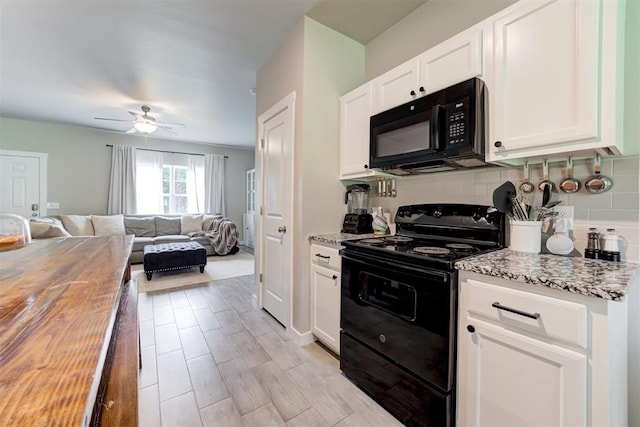 kitchen featuring ceiling fan, wooden counters, white cabinets, black appliances, and open floor plan