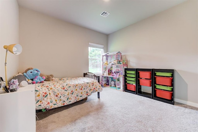 carpeted bedroom with baseboards and visible vents