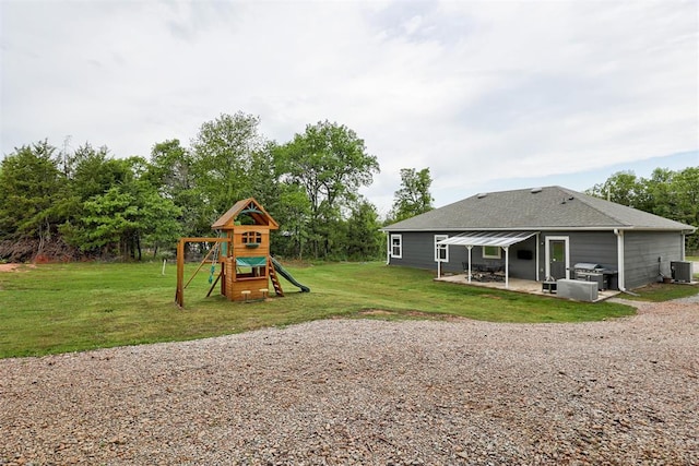 exterior space featuring a lawn, a patio, and central AC unit