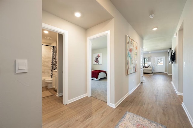 10232 NW 28th St, Yukon, OK 73099 - hall featuring baseboards, recessed lighting, and light wood finished floors