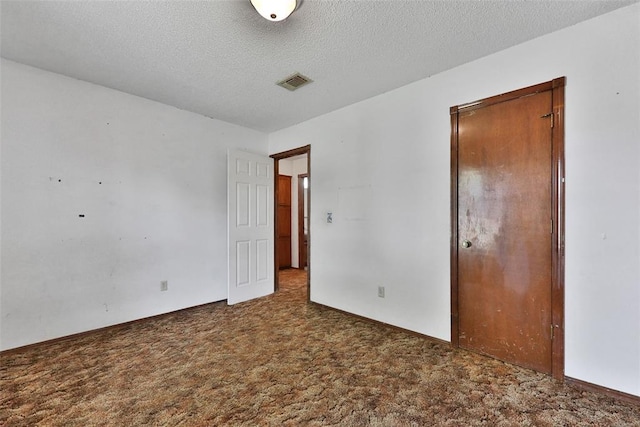 208 Harrogate Dr, Yukon, OK 73099 - unfurnished room featuring carpet, a textured ceiling, and baseboards