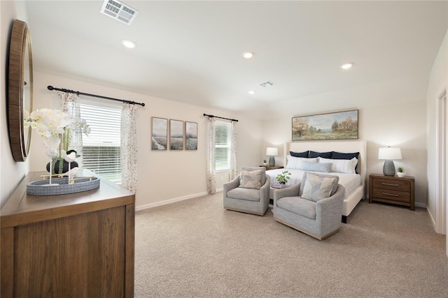 bedroom featuring light colored carpet, baseboards, and visible vents