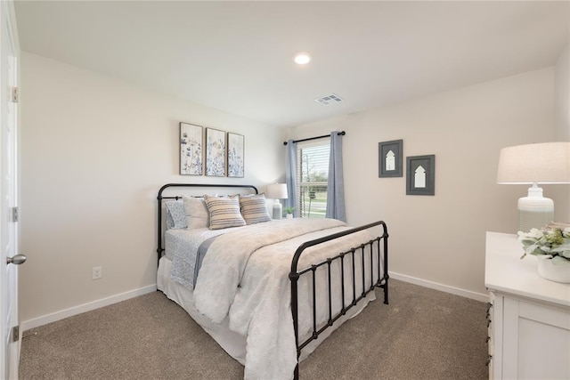 bedroom with recessed lighting, baseboards, light colored carpet, and visible vents