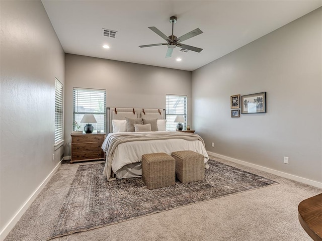 bedroom featuring multiple windows, carpet flooring, and visible vents