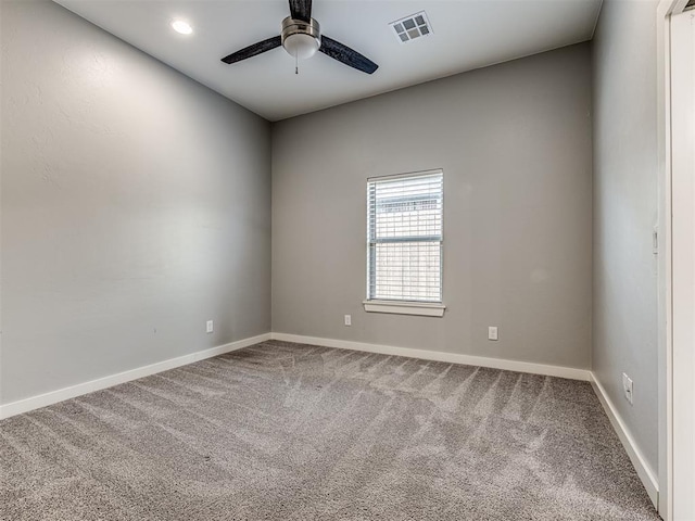 unfurnished room featuring carpet, a ceiling fan, baseboards, recessed lighting, and visible vents
