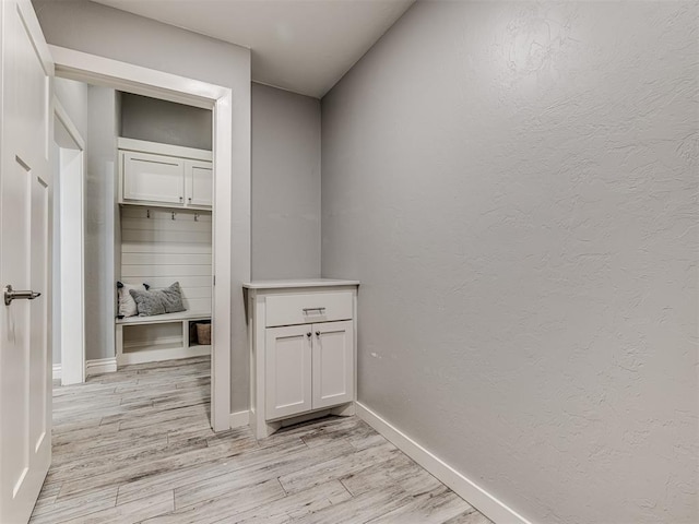 interior space with light wood-type flooring and baseboards
