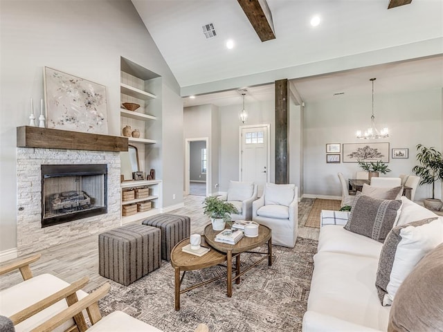 3209 Hunter Crest Dr, Edmond, OK 73034 - living area featuring high vaulted ceiling, baseboards, a chandelier, wood finished floors, and built in features
