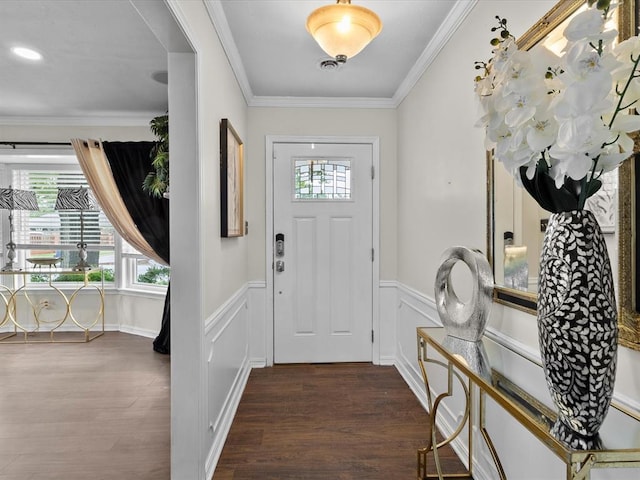 entrance foyer with crown molding, wainscoting, and wood finished floors