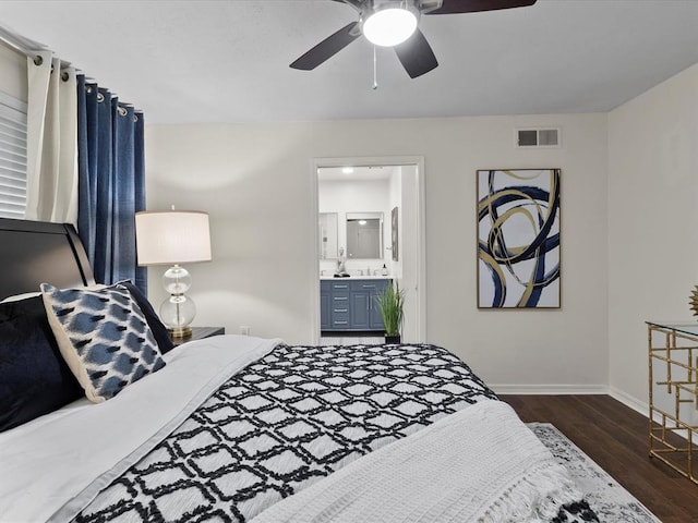 bedroom featuring ceiling fan, visible vents, baseboards, dark wood-style floors, and connected bathroom
