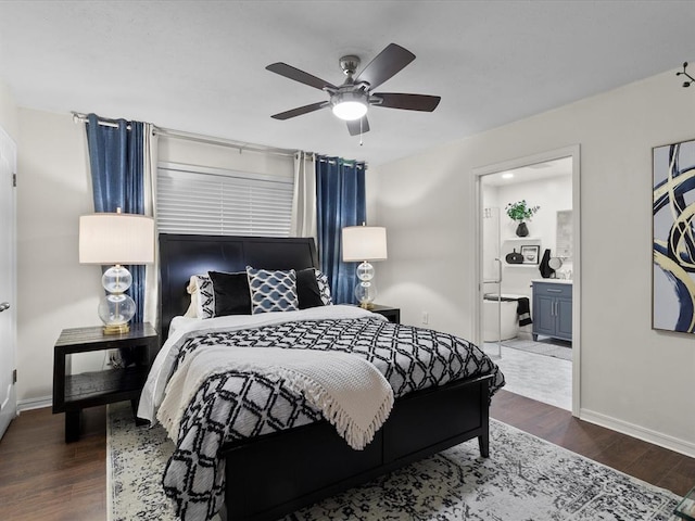 bedroom featuring baseboards, ensuite bath, wood finished floors, and ceiling fan