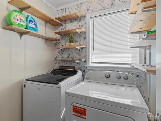 washroom featuring ornamental molding, laundry area, washing machine and dryer, and wallpapered walls