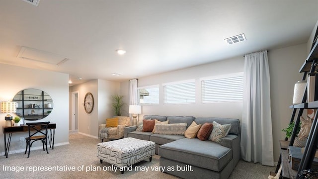 carpeted living area with baseboards, visible vents, and attic access