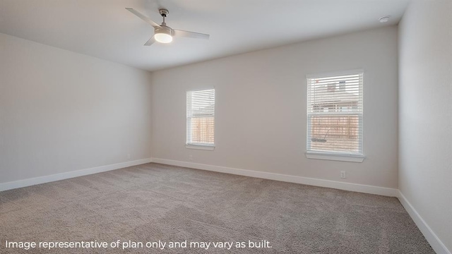 unfurnished room with ceiling fan, plenty of natural light, and light carpet