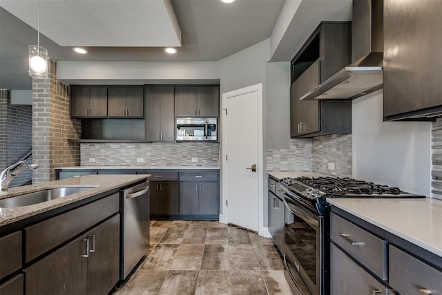 kitchen with open shelves, dark brown cabinetry, wall chimney range hood, a sink, and stainless steel appliances