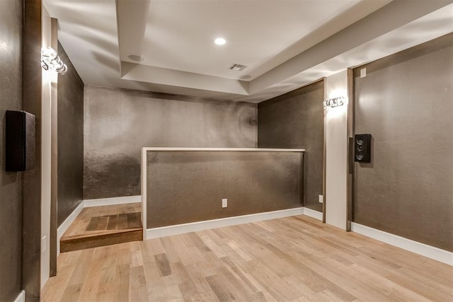 finished below grade area featuring wood finished floors