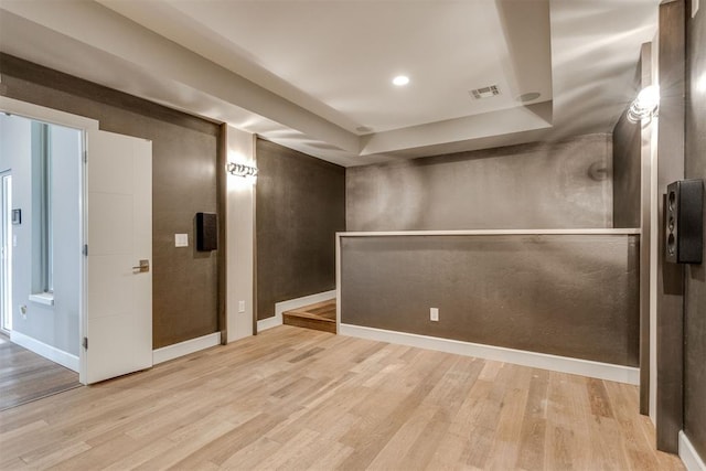 interior space with recessed lighting, baseboards, visible vents, and wood finished floors