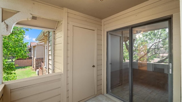 entryway featuring visible vents and wood walls