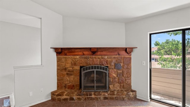 room details with baseboards and a fireplace