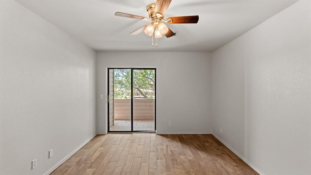 empty room with a ceiling fan, baseboards, and light wood-style floors