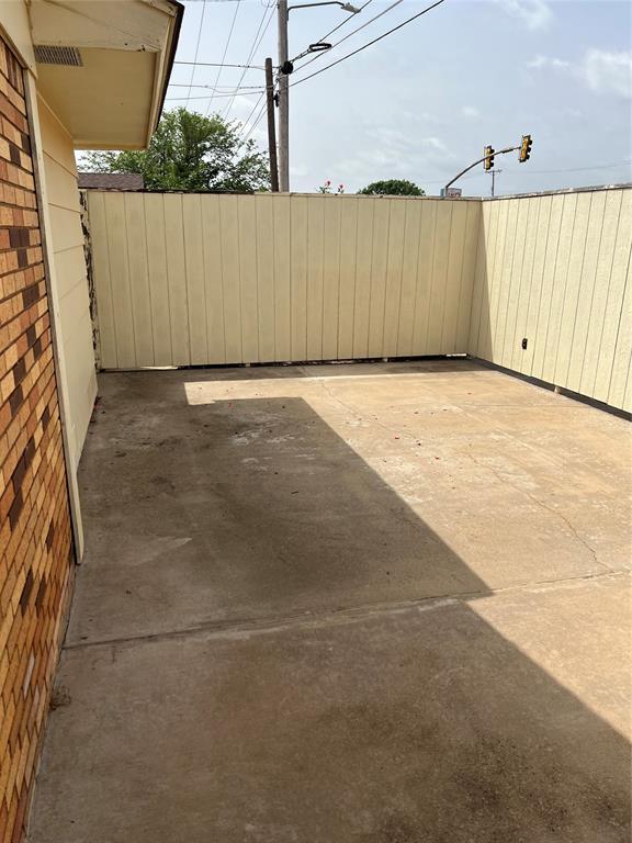view of patio featuring fence