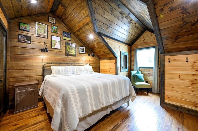 bedroom with wooden walls, wood ceiling, hardwood / wood-style flooring, and lofted ceiling