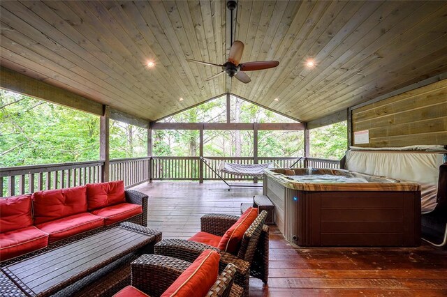 sunroom featuring a ceiling fan and outdoor lounge area