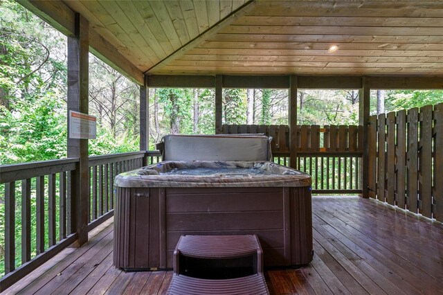 wooden terrace featuring a hot tub