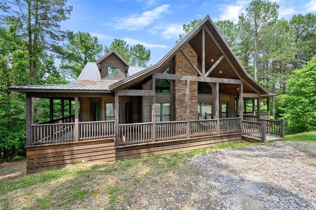view of front of property featuring a porch and metal roof