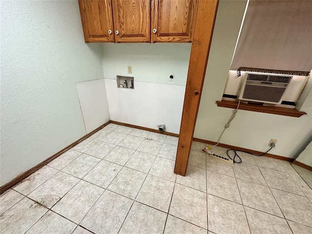 laundry area with washer hookup, hookup for an electric dryer, cabinet space, baseboards, and cooling unit