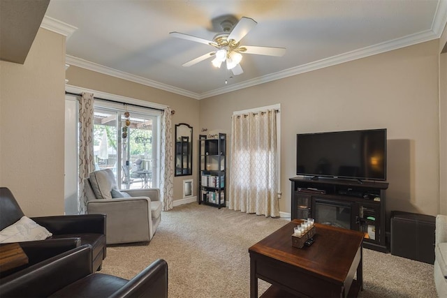 living area featuring carpet flooring, ceiling fan, ornamental molding, and baseboards