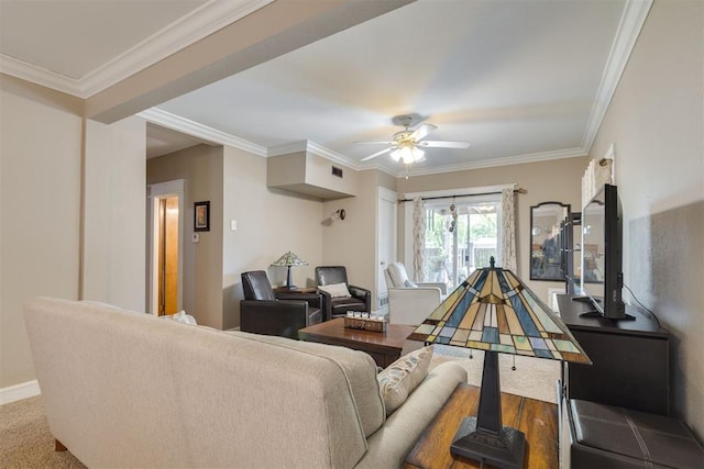 living room with crown molding, a ceiling fan, baseboards, and visible vents