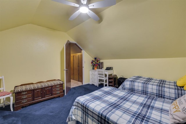 carpeted bedroom with a ceiling fan and vaulted ceiling
