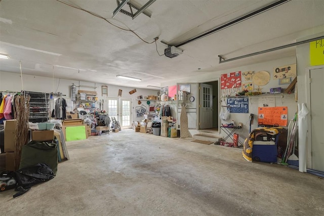 garage featuring french doors and a garage door opener