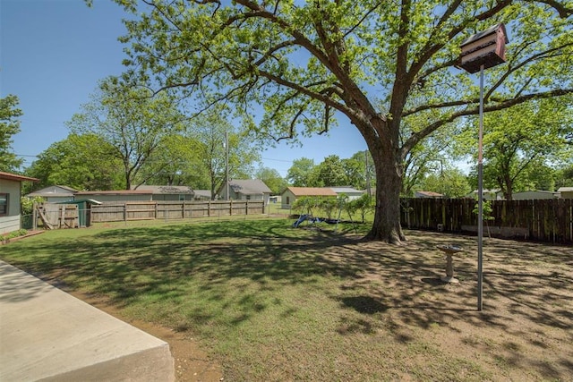view of yard with a fenced backyard