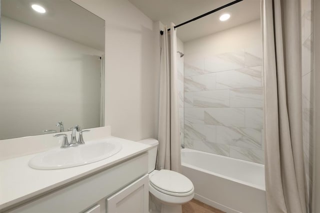 bathroom featuring recessed lighting, vanity, toilet, and shower / tub combo with curtain