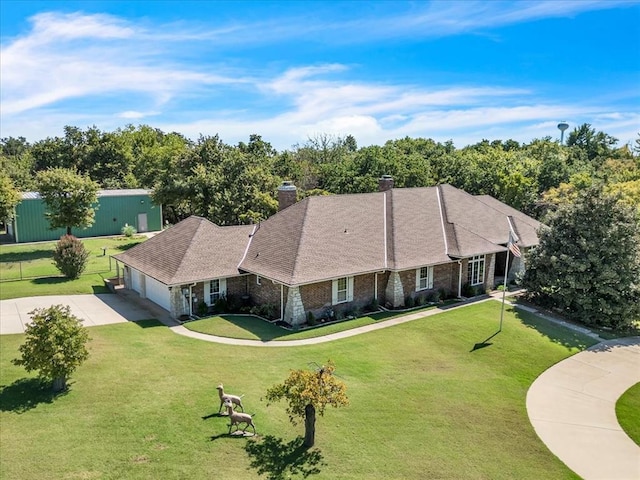 1008 Bavarian Dr, Edmond, OK 73034 - view of front facade with concrete driveway, a front lawn, an attached garage, a chimney, and a shingled roof