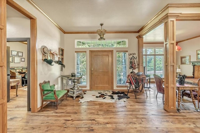1008 Bavarian Dr, Edmond, OK 73034 - entryway featuring wood finished floors and ornamental molding