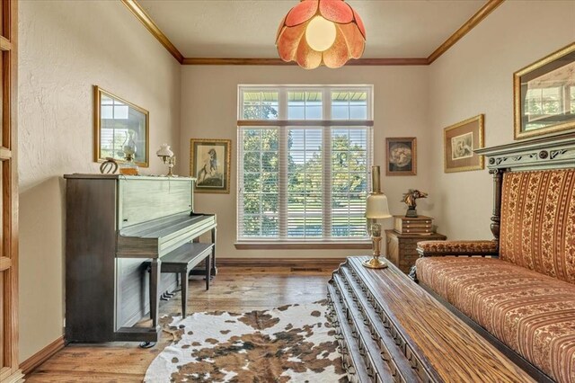 1008 Bavarian Dr, Edmond, OK 73034 - living area with wood finished floors and ornamental molding
