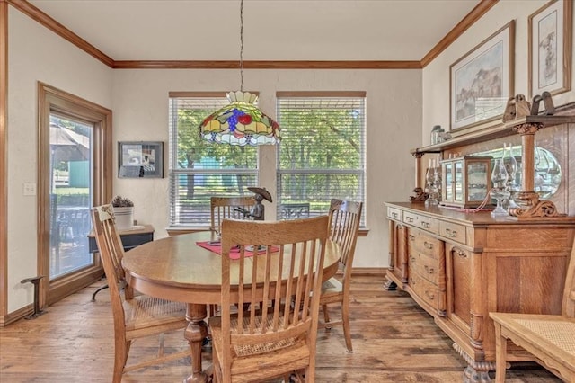 1008 Bavarian Dr, Edmond, OK 73034 - dining area featuring light wood-style flooring and ornamental molding