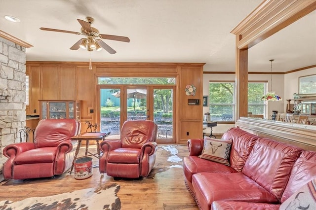 1008 Bavarian Dr, Edmond, OK 73034 - living room featuring crown molding, wood finished floors, and a ceiling fan