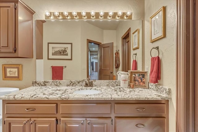 1008 Bavarian Dr, Edmond, OK 73034 - bathroom with vanity and a textured wall