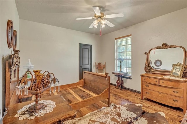 1008 Bavarian Dr, Edmond, OK 73034 - bedroom featuring light wood-style floors and ceiling fan