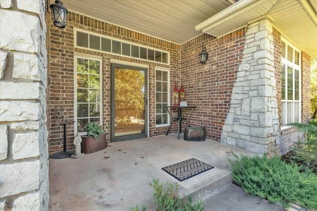 1008 Bavarian Dr, Edmond, OK 73034 - entrance to property featuring brick siding and a patio area