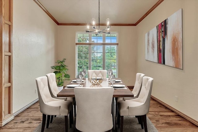 1008 Bavarian Dr, Edmond, OK 73034 - dining room featuring a chandelier, light wood-style floors, and ornamental molding