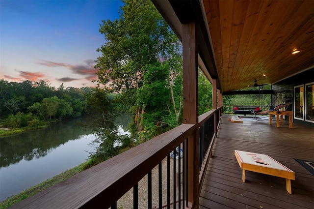 370 Stones River Ln, Broken Bow, OK 74728 - deck at dusk featuring a water view