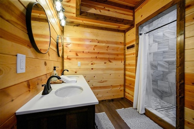 370 Stones River Ln, Broken Bow, OK 74728 - full bathroom featuring wood walls, a shower stall, vanity, and wood finished floors
