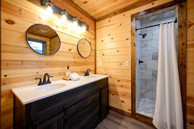 370 Stones River Ln, Broken Bow, OK 74728 - bathroom with wood walls, wood finished floors, a tile shower, wooden ceiling, and double vanity