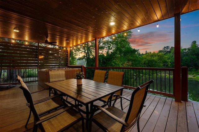 370 Stones River Ln, Broken Bow, OK 74728 - wooden terrace with outdoor dining area and ceiling fan