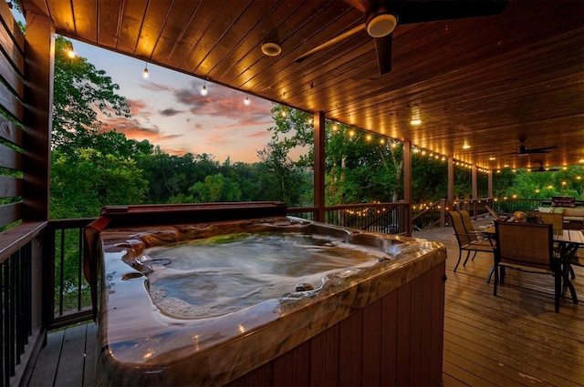 370 Stones River Ln, Broken Bow, OK 74728 - deck with a hot tub, outdoor dining area, and ceiling fan